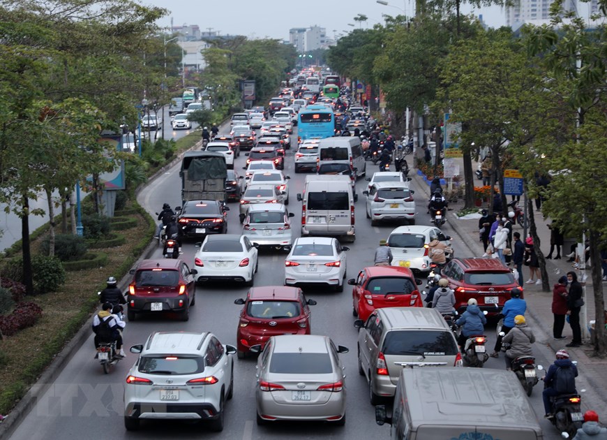 [Photo] Lỉnh kỉnh đồ đạc, nhiều người rời Hà Nội về quê đón Tết - Ảnh 5.