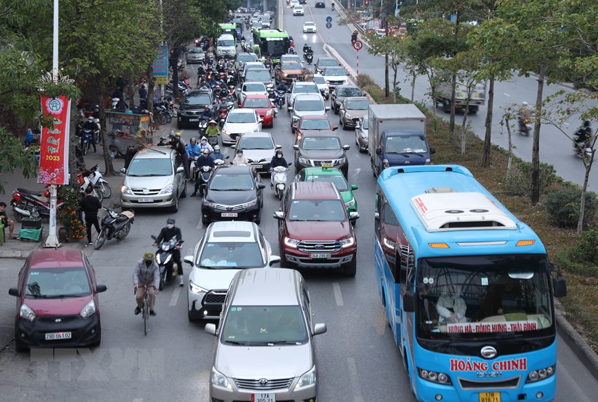 [Photo] Lỉnh kỉnh đồ đạc, nhiều người rời Hà Nội về quê đón Tết - Ảnh 6.