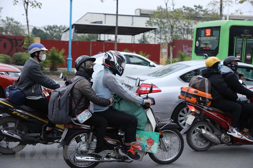 [Photo] Lỉnh kỉnh đồ đạc, nhiều người rời Hà Nội về quê đón Tết - Ảnh 9.
