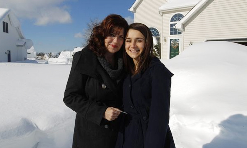 Karen Rossi was happily reunited with her daughter, Madelyn, 17, after spending 13 hours trapped in a snowbank in her car. John Hickey/Buffalo News