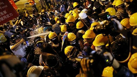 Police use pepper spray during clashes with pro-democracy protesters close to the government headquarters in Hong Kong, on Nov 30, 2014. -- PHOTO: REUTERS 