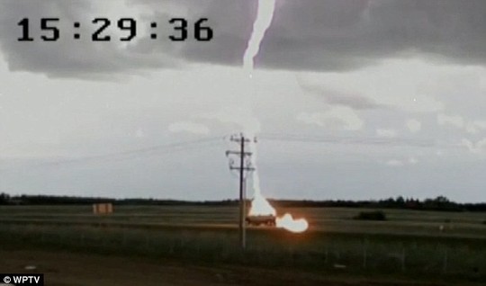 Shocking: The lightning lights up the sky as it strikes a pick up truck on Saturday