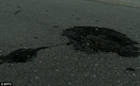 Impact: Potholes mark the road surface at the points where the lightning made contact