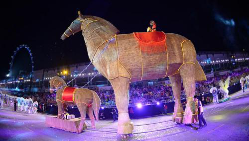 On the first run of the parade last night, horses from the Singapore Turf Club, along with performers bearing horse sculptures designed by Nanyang Academy of Fine Arts students, marched down the street, alongside floats and performers from different local and foreign groups in a two-hour extravaganza. with giant puppets, an 8m-tall straw horse, and the countrys largest batik painting. 