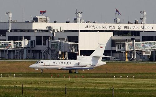 In this file photo taken May 31, 2011, a Serbian government Falcon plane prepares for take off at a Belgrade International Airport, Serbia. An investigation shows that a sudden plunge of the Serbian presidents plane last week which triggered panic among passengers and an emergency return to Belgrade was caused by the co-pilot who spilled coffee on the instruments panel. (AP Photo/Darko Vojinovic, File)