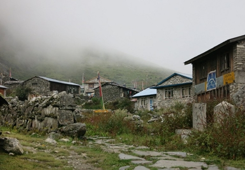 This photo taken on September 11, 2014 shows a general view of the village of Langtang, in the remote Nepalese district of Rasuwa bordering Chinas Tibet. Nine days after a 7.8-magnitude quake brought death and destruction to the Himalayan nation of Nepal, US helicopters on May 4, 2015 began to assess remote areas of Nepal devastated by the earthquake that killed more than 7,300 people. Many foreign victims were in the popular Langtang trekking region north of Kathmandu when the quake struck. AFP PHOTO / MOIRA SHAW