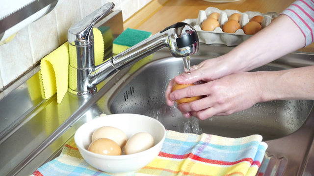 woman hands washing eggs in kitchen under water stream 4kh5xisnalgthumbnail full01 15380218450861036583701 16522583707791906801877