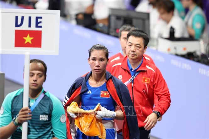 Olympic 2024: Nữ võ sĩ Hà Thị Linh chiến thắng trước đối thủ người Tonga- Ảnh 1.