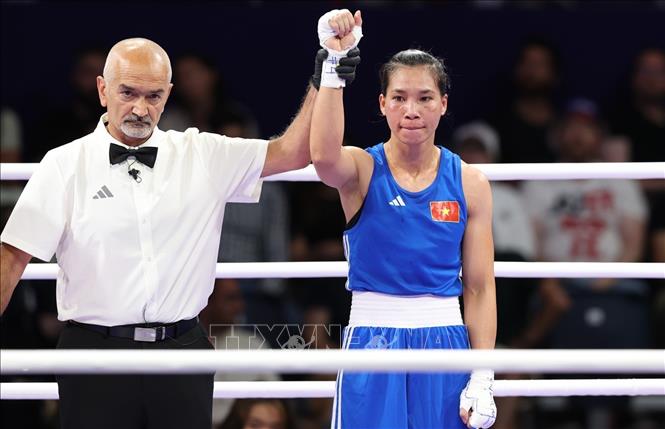 Olympic 2024: Nữ võ sĩ Hà Thị Linh chiến thắng trước đối thủ người Tonga- Ảnh 5.