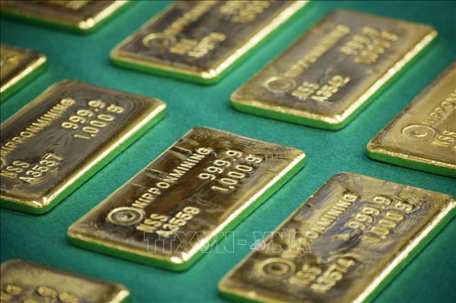 Vàng tái lập mốc 5.000 USD sau phán quyết thuế quan từ Mỹ- Ảnh 1.