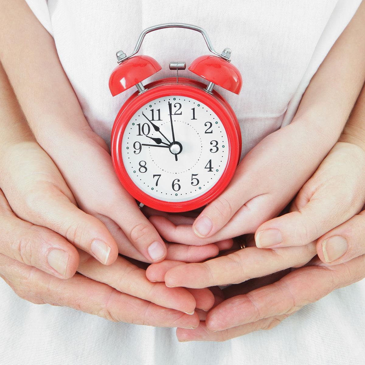 A close - up of hands holding a stopwatchDescription automatically generated with medium confidence