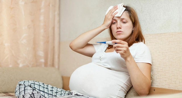 Bệnh cúm nguy hiểm với phụ nữ mang thai và thai nhi như thế nào? - Ảnh 2.
