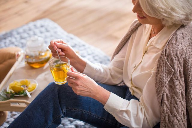 elderly woman drinking tea 16722184744772047562113