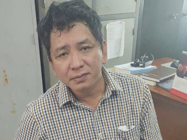 Nguyên giám đốc bị truy nã đặc biệt ra đầu thú- Ảnh 1.