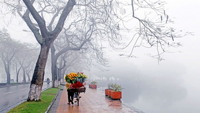 Miền Bắc rét buốt kèm nồm ẩm khiến gia tăng cảm giác buốt giá- Ảnh 1.