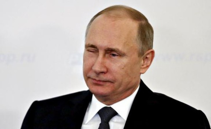 Russias President Vladimir Putin tips a wink during a session at the Week of Russian Business, organized by the Russian Union of Industrialists and Entrepreneurs (RSPP), in Moscow, March 19, 2015. REUTERS/Maxim Zmeyev