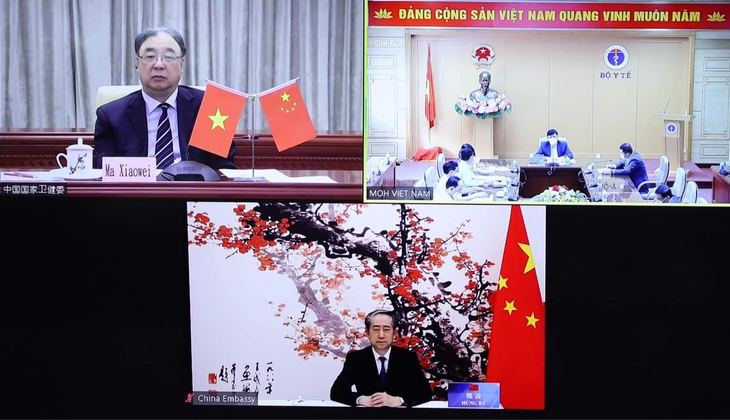 Lãnh đạo Y tế Việt Nam - Trung Quốc chia sẻ kinh nghiệm về phòng chống dịch COVID-19 - Ảnh 1.