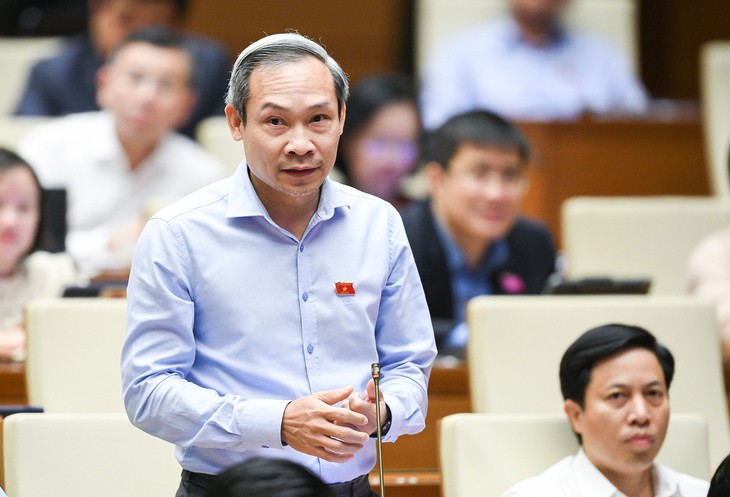 Đại biểu chất vấn tình trạng kẹt xe, ngập úng ở đô thị lớn, Bộ Xây dựng nói… do quy hoạch - Ảnh 4.