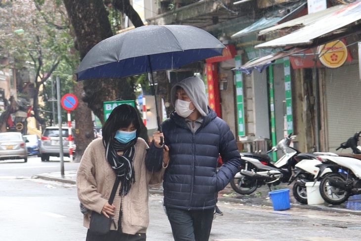 Chùm ảnh- Người dân Hà Nội trải nghiệm cái lạnh tê tái - Ảnh 6. Chùm ảnh- Người dân Hà Nội trải nghiệm cái lạnh tê tái - Ảnh 6.