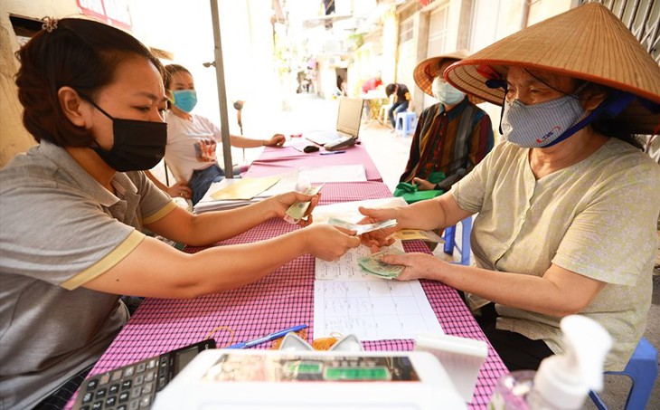 Vì sao lương hưu ở Việt Nam thấp dù tỷ lệ hưởng cao nhất thế giới?- Ảnh 1.