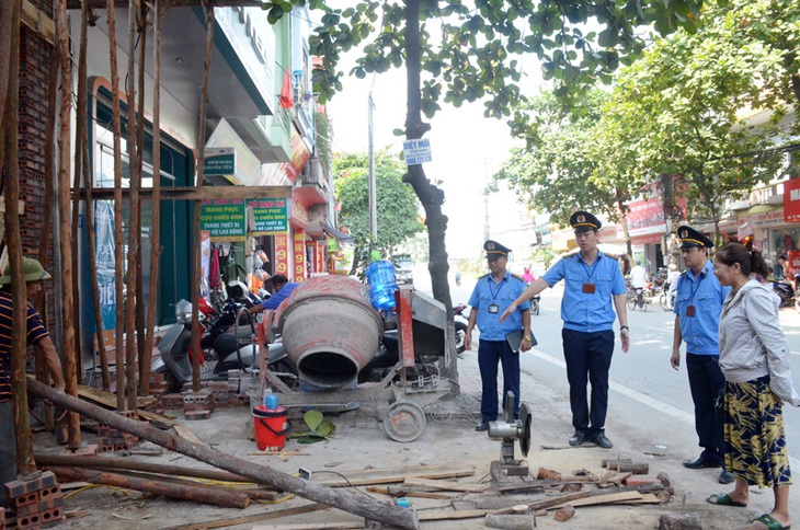 Chính phủ đồng ý cho Hà Nội tiếp tục thí điểm mô hình Đội quản lý trật tự xây dựng đô thị - Ảnh 1.
