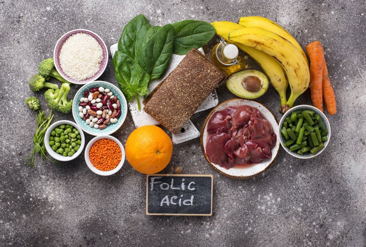 Dinh dưỡng giàu axit folic dự phòng dị tật thai nhi - Ảnh 1.