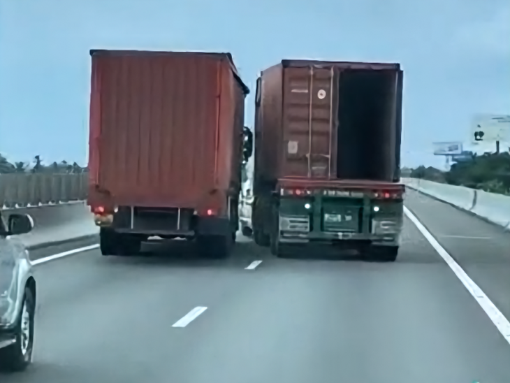 Vì sao tài xế xe tải và container rời xe, rượt đuổi nhau trên đường cao tốc?- Ảnh 2. Vì sao tài xế xe tải và container rời xe, rượt đuổi nhau trên đường cao tốc?- Ảnh 2.