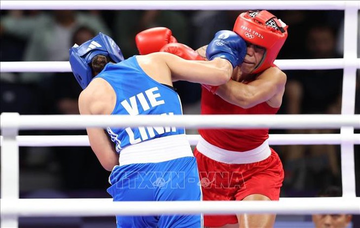 Olympic 2024: Nữ võ sĩ Hà Thị Linh chiến thắng trước đối thủ người Tonga- Ảnh 4. Olympic 2024: Nữ võ sĩ Hà Thị Linh chiến thắng trước đối thủ người Tonga- Ảnh 4.