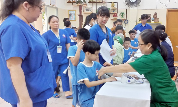 TPHCM: Hướng tới thành phố không rào cản cho người khuyết tật- Ảnh 2.