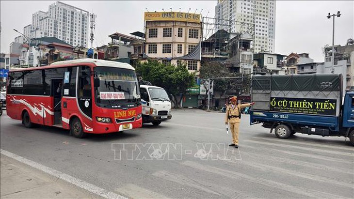 Cảnh sát giao thông sẽ dẫn đường, hỗ trợ các đoàn chở nhân dân về quê ăn Tết- Ảnh 1.