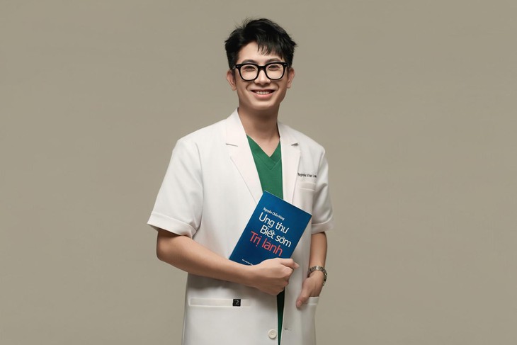 A person in a white coat holding a blue book  AI-generated content may be incorrect.