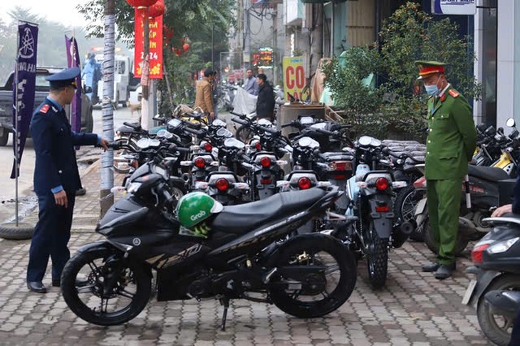Hà Nội dự kiến thu phí vỉa hè trông xe không quá 400.000/m2 mỗi tháng - Ảnh 2.