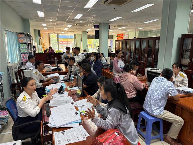 Hộ kinh doanh không bắt buộc ghi chép sổ kế toán bằng tay- Ảnh 1.