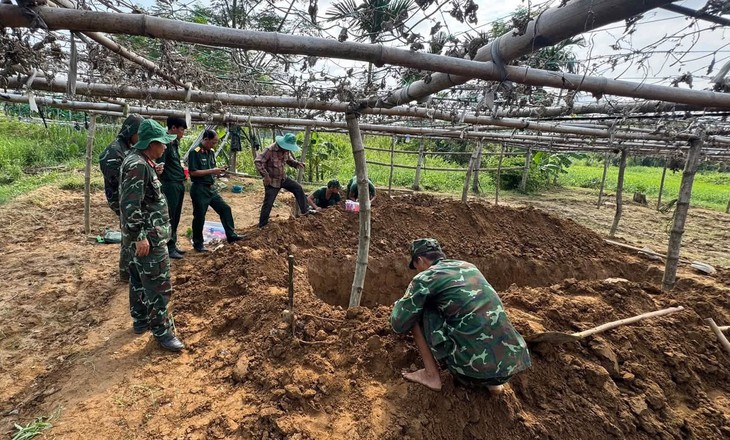 Phát hiện hài cốt liệt sĩ trong vườn hoa màu ở phường Hội An- Ảnh 1.