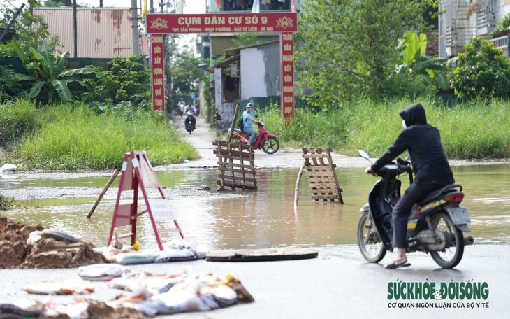Hà Nội: Nhiều hố ga mất nắp trên đường Phạm Văn Đồng - Ảnh 9.