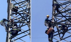 Giải cứu một phụ nữ trèo lên đỉnh cột điện cao thế 25m