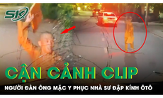 Clip người đàn ông mặc y phục nhà sư chặn đầu, đập vỡ cửa kính ô tô