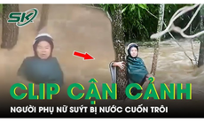 Cận cảnh khoảnh khắc người dân ném dây thừng cứu người phụ nữ bị nước cuốn trôi cùng xe máy