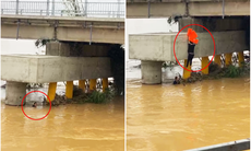 'Thót tim' cảnh nam thanh niên đu dây xuống chân cầu nước chảy cuồn cuộn cứu người