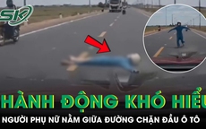 Người phụ nữ lao ra nằm giữa đường, chặn đầu ô tô gây xôn xao dư luận