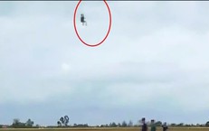 Thót tim cảnh người đàn ông đu dây diều, treo lơ lửng giữa không trung