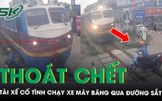 Tài xế thoát chết trong gang tấc khi vừa dùng điện thoại vừa cố tình chạy xe máy băng qua đường sắt