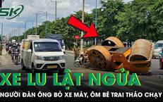 Xe lu lật ngửa giữa đường, người đàn ông bỏ xe máy ôm bé trai tháo chạy
