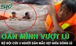 Bộ đôi căng dây oằn mình vượt dòng lũ cuồn cuộn cứu 3 người dân bị mắc kẹt 