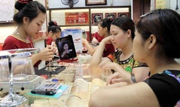 Giá vàng SJC điều chỉnh không đồng nhất, tỷ giá trung tâm đi ngang