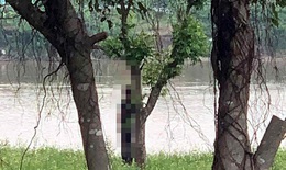 Lực lượng công an đang điều tra thi thể thanh niên treo trên cành cây