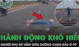 Người phụ nữ lao ra nằm giữa đường, chặn đầu ô tô gây xôn xao dư luận
