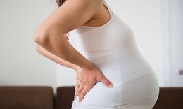 Đau vùng chậu khi mang thai phải làm gì?