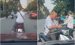 Xôn xao clip người đàn ông ngang nhiên chặn đường, đòi tiền đỗ xe ở Hà Nội