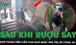 Uống rượu xong, nam thanh niên cầm 2 con dao trèo qua cổng vào trụ sở công an quậy phá 